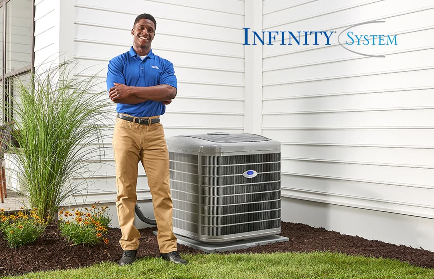 Carrier dealer beside an installed Infinity heat pump